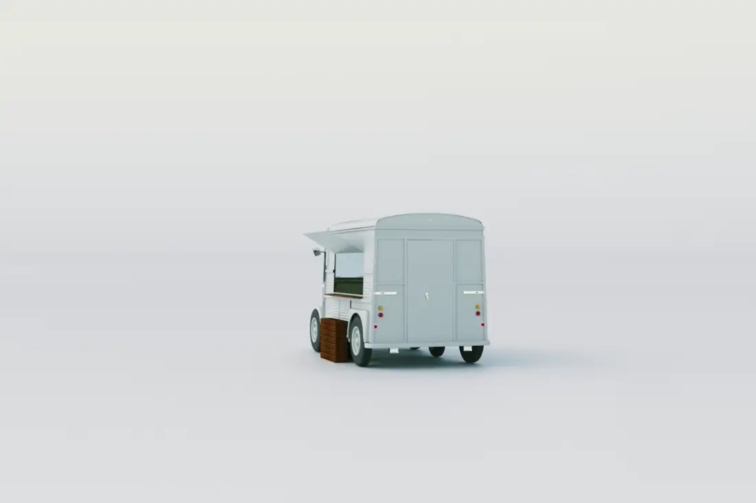 Remorque Citroën HY bleu-gris aménagée en food truck, hayon relevé et comptoir déployé